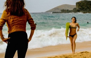 Kono (Grace Park) waits for Catherine (Michelle Borth) to finish surfing before seeking a favor. ~ CBS